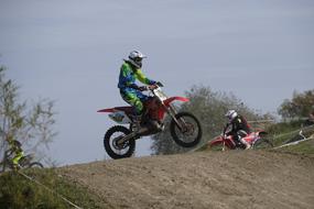 motocross on a hilly dusty track