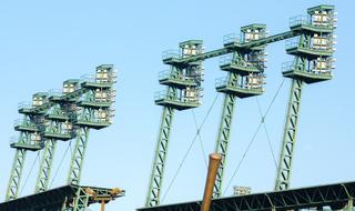 Close-up of the stadium lights in sunlight, under the blue sky