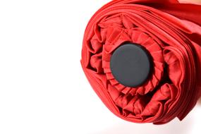 red umbrella on white background close up