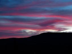 Beautiful landscape with silhouette of the mountain, at colorful and beautiful sunrise with clouds