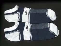 Close-up of the pair of colorful socks, on the dark surface