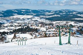 Beautiful, snowy landscape of Ochodzita mountain with ski lift, in Poland, in the winter