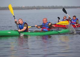 people sail on a boat during the competition