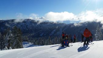 people skiing on scenic mountains, usa, california, squaw valley