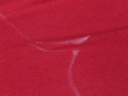 red t-shirt with salty spots close-up