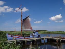 picturesque Fishing Boat at pier in countryside