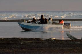 people on a boat in alaska