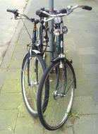 bicycles near the pole On Pavement