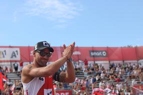 Volleyball fans, playing volleyball in the summer, under the blue sky with white clouds