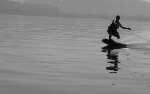 wakeboarding on the lake at dusk