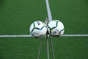 metal stand with balls for soccer match