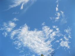 white transparent clouds in clear sky