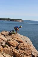 rock climbing above water on a sunny day