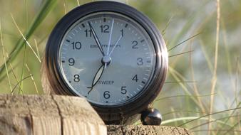 alarm clock with time on blurred background