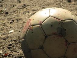 Close-up of the football ball in light and shadow