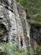 rock climber on raumabanen stone bridge in Norway