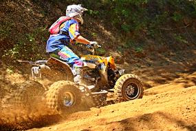 ATV in dust on motocross