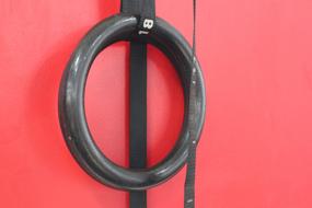 Gymnastic Rings on the red wall close-up