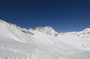 blue sky over snowy mountain plateau