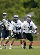 Lacrosse Players on the field on a blurred background