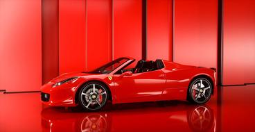 Shining red car on red background