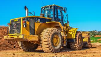 Bulldozer Heavy Machine Equipment on a construction site on a sunny day