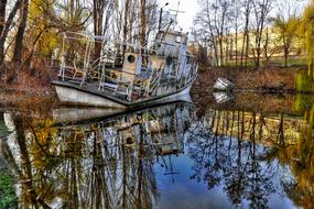 abandoned ship on a mirror pond in Ukraine
