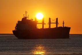 Freighter ship on Water at Sunset