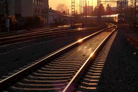 landscape of the railway tracks under the rays of the evening sun