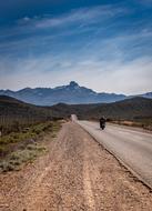 motorcyclist rides on a road in South Africa