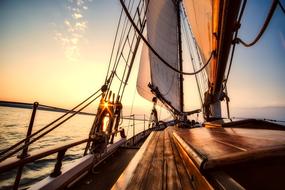 photo of the deck of a yacht at sunset