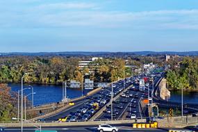 movement of cars on a bridge over a river