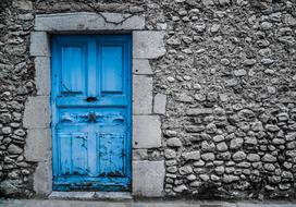 Old Vintage Blue Door in stone wall