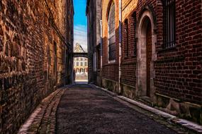 old brick buildings on empty alley in Historic Center of city