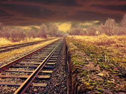 digital image of railway tracks under the evening sky