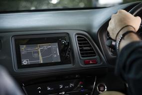 Person, driving the car, with the navigation