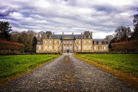 road to old palace at cloudy autumn evening