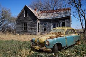 Borgward Hansa, wrecked Oldtimer Car at abandoned wooden building