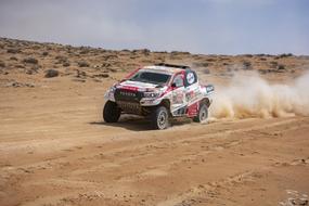 photo of a racing car at the Dakar Rally