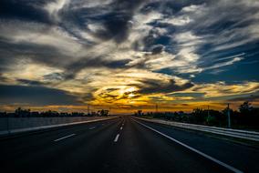Highway beneath dramatic Sky