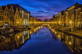 night photo of buildings on the canal in Holland