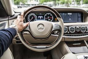 male hand on Steering Wheel Car Drive