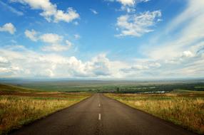 Beautiful landscape with the road among the colorful nature