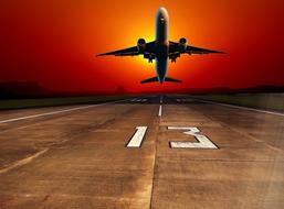 airplane take off at sunset as an illustration