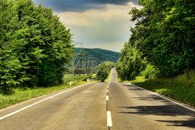 empty asphalt road among picturesque rural landscape