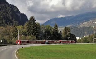 train on railway in switzerland mountains