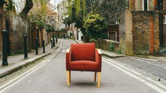 red armchair on a city street