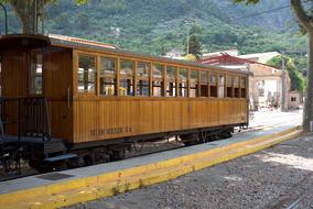 vintage wooden passenger carriage at platform