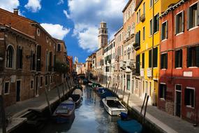 empty boats along a canal in Venice, Italy