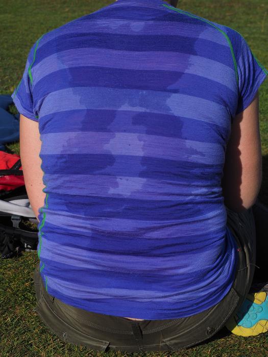 Sweating person, in blue t-shirt, on the welding margins